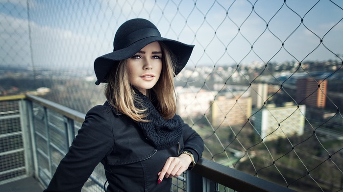hat, black clothing, rooftops, depth of field, portrait, blonde, girl outdoors, millinery, girl, brown eyes, face, red nails