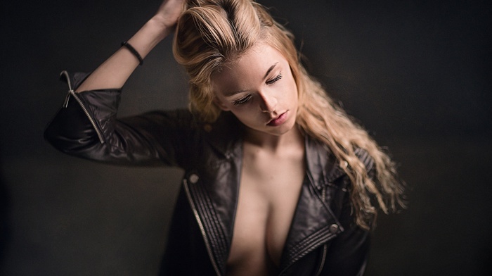 leather jackets, depth of field, cleavage, face, model, girl, long hair, hands in hair, blonde