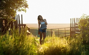 jean shorts, fence, grass, sunlight, girl
