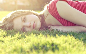 girl outdoors, grass, lying on side, sun rays, red tops, face