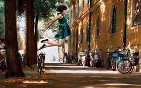 jumping, bicycle, girl, brunette, street, lights