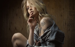 jean jacket, bare shoulders, finger on lips, tattoos, girl, blonde