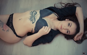 black lingerie, on the floor, girl, pierced navel, tattoos