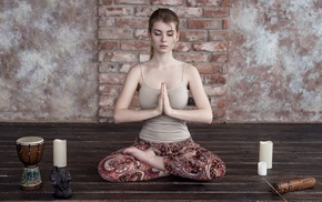 yoga, legs crossed, pale, candles, Irina Popova, tank top