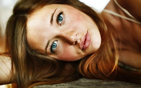 lying on side, freckles, looking at viewer, girl, blue eyes, face