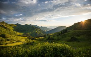 Mountain Range With Sunlight And Clouds