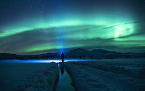 Solitary Figure Amidst Northern Lights