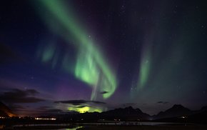 Aurora Borealis Over Mountains At Night