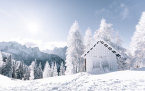 White Barn Amidst Snowy Mountain Range