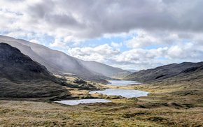 Hebrides Lake In Grassy Field