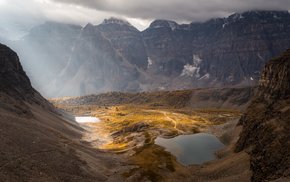 Lake In Mountain Range With Clouds