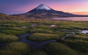 Snowy Mountain Sunset Over Grassy Field