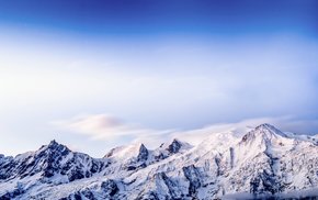 Snow-Covered Alpine Peaks And Trees