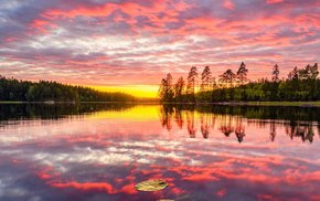 Lake Sunset With Pink Clouds And Reflection