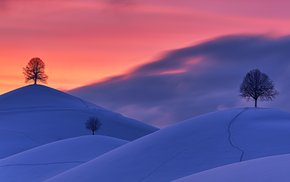 Snow-Covered Hills At Sunset