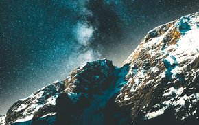 Snowy Rock Illuminated By Milky Way