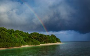 Rainbow Over Island With Lush Trees