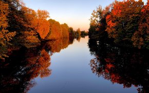 Autumnal River Scene With Changing Leaves